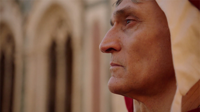 Profile of a man in historical attire.